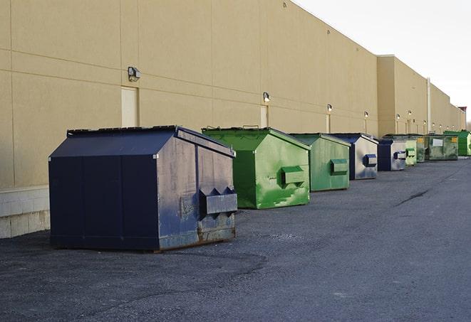 a fleet of red and blue construction dumpsters available for use in Oracle